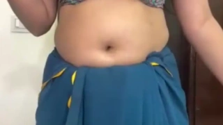 This horny Indian bhabhi forgot to wear her bra properly while live cam dancing, showing one big boob